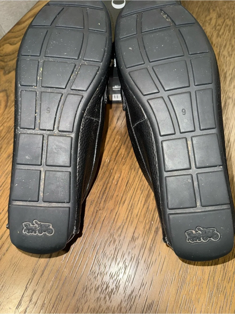 Coach Black Leather Loafers with Gold Chain Accent